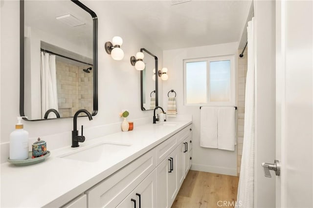 5662 Trail View Pl, Yorba Linda, CA 92886 - bathroom featuring double vanity, wood finished floors, and a shower with shower curtain