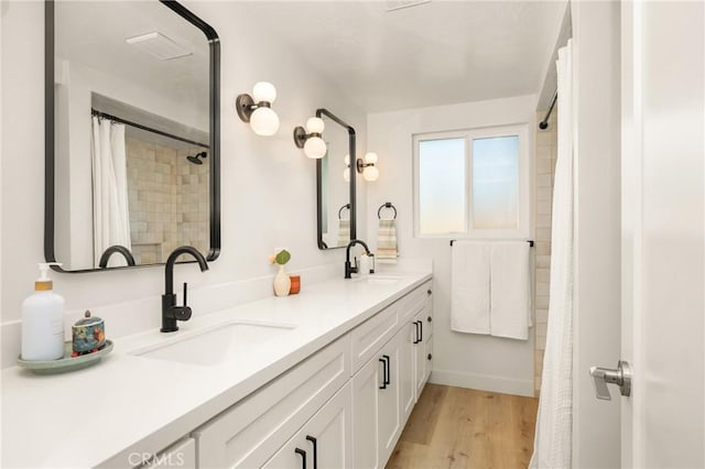 5662 Trail View Pl, Yorba Linda, CA 92886 - full bathroom featuring double vanity, wood finished floors, and a shower with shower curtain