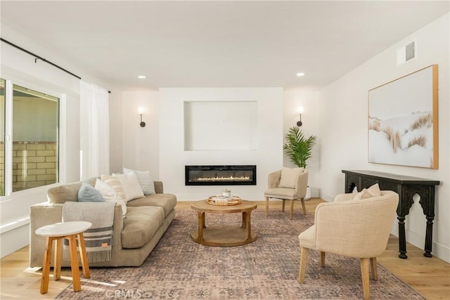 5662 Trail View Pl, Yorba Linda, CA 92886 - living area with wood finished floors, a glass covered fireplace, and recessed lighting