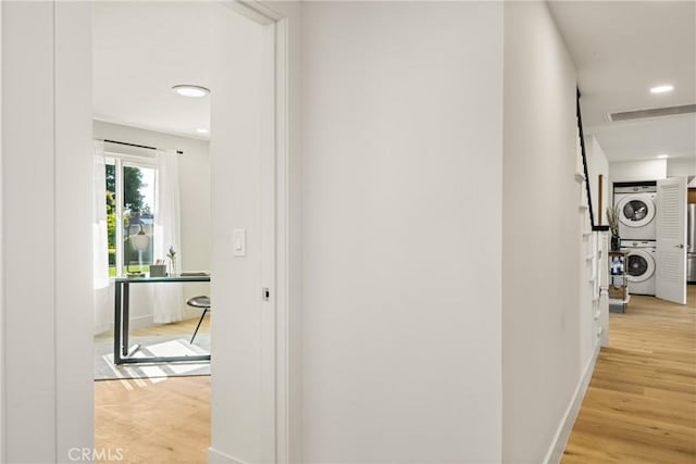 5662 Trail View Pl, Yorba Linda, CA 92886 - hallway with stacked washing machine and dryer, a desk, light wood-style floors, and recessed lighting