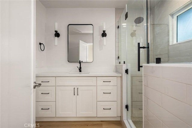 5662 Trail View Pl, Yorba Linda, CA 92886 - bathroom featuring a shower stall, vanity, and wood finished floors