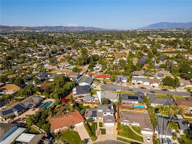 5662 Trail View Pl, Yorba Linda, CA 92886 - aerial view of property and surrounding area featuring a mountainous background and nearby suburban area