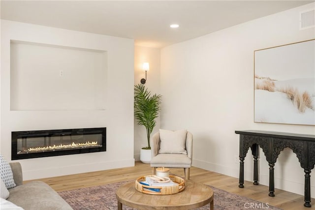 5662 Trail View Pl, Yorba Linda, CA 92886 - living area with a glass covered fireplace, recessed lighting, wood finished floors, and baseboards