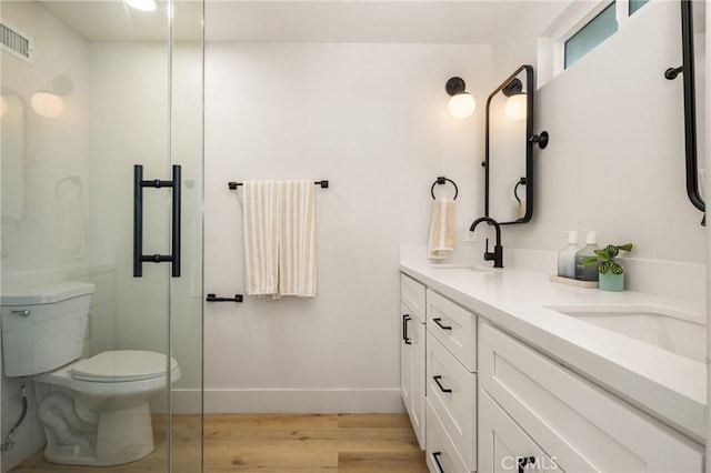 5662 Trail View Pl, Yorba Linda, CA 92886 - full bath with wood finished floors, double vanity, baseboards, toilet, and an enclosed shower