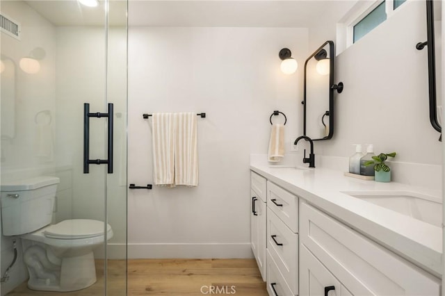 5662 Trail View Pl, Yorba Linda, CA 92886 - bathroom featuring wood finished floors, double vanity, and an enclosed shower