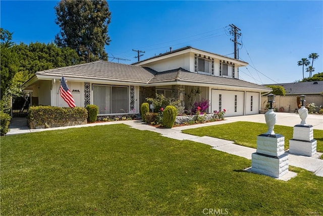 1403 W Westmont Dr, Anaheim, CA 92801 - view of front of home featuring a tile roof, concrete driveway, and a garage
