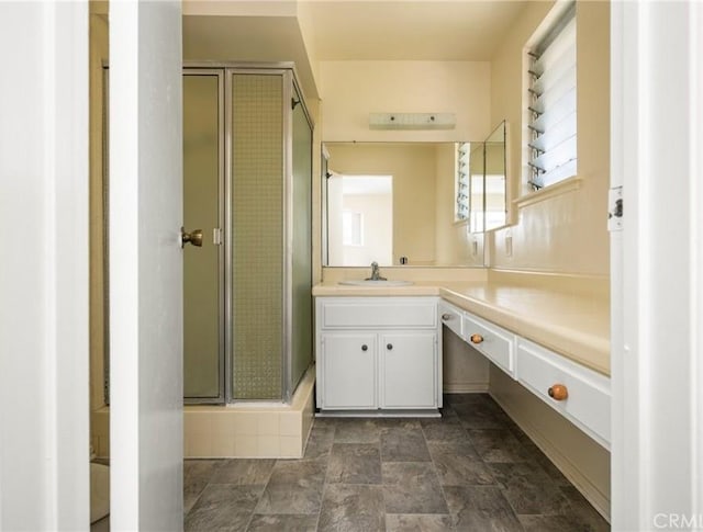 1403 W Westmont Dr, Anaheim, CA 92801 - full bathroom featuring vanity, a stall shower, and stone finish floors
