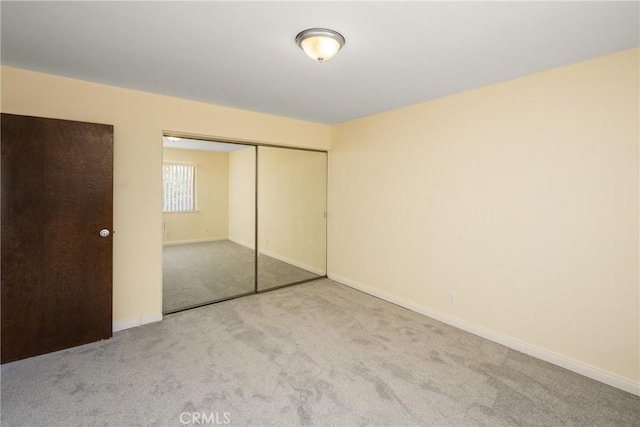 1403 W Westmont Dr, Anaheim, CA 92801 - unfurnished bedroom featuring carpet flooring, a closet, and baseboards