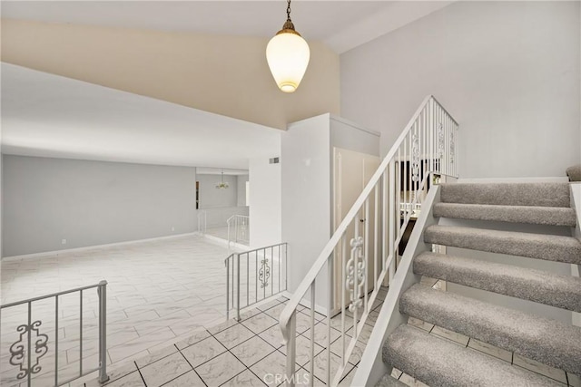 1403 W Westmont Dr, Anaheim, CA 92801 - stairway with baseboards and marble look tile flooring