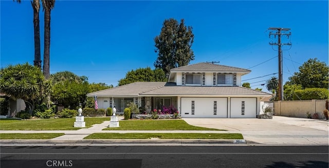 1403 W Westmont Dr, Anaheim, CA 92801 - view of front of house featuring concrete driveway and a tiled roof