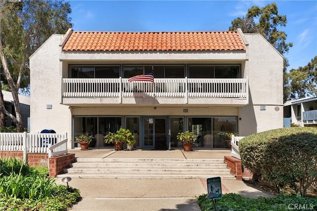 810 Camino Real Unit 104, Redondo Beach, CA 90277 - back of house featuring a balcony, stucco siding, and a tiled roof