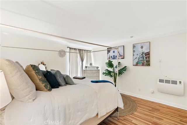 810 Camino Real Unit 104, Redondo Beach, CA 90277 - bedroom featuring baseboards, wood finished floors, and crown molding