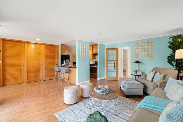 810 Camino Real Unit 104, Redondo Beach, CA 90277 - living area with crown molding, wood finished floors, french doors, recessed lighting, and baseboards