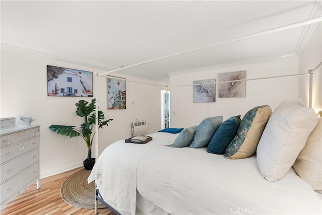 810 Camino Real Unit 104, Redondo Beach, CA 90277 - bedroom with crown molding, light wood-type flooring, and baseboards