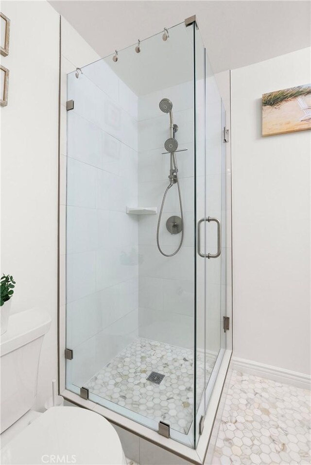 810 Camino Real Unit 104, Redondo Beach, CA 90277 - full bathroom featuring toilet, a shower stall, and baseboards