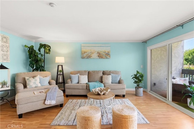 810 Camino Real Unit 104, Redondo Beach, CA 90277 - living room featuring wood finished floors, ornamental molding, and baseboards