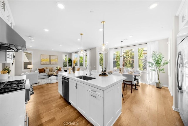 10 Veraz Rd, Rancho Mission Viejo, CA 92694 - kitchen with a sink, stainless steel appliances, under cabinet range hood, recessed lighting, and light countertops
