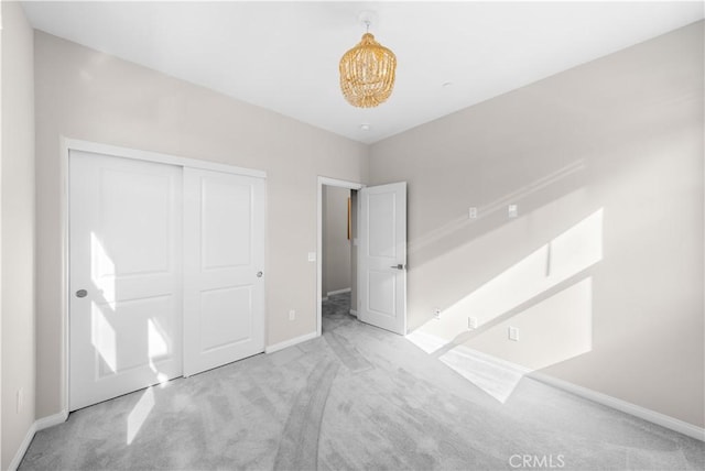 10 Veraz Rd, Rancho Mission Viejo, CA 92694 - unfurnished bedroom featuring carpet floors, baseboards, a closet, and a chandelier