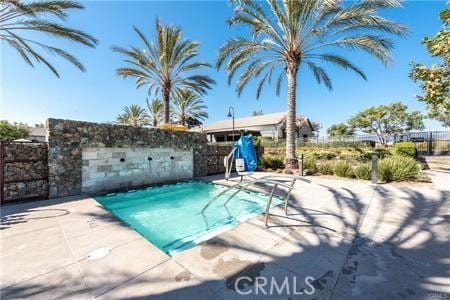 10 Veraz Rd, Rancho Mission Viejo, CA 92694 - view of swimming pool with a patio, a swimming pool, and fence