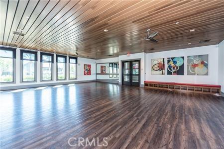 10 Veraz Rd, Rancho Mission Viejo, CA 92694 - unfurnished living room featuring wood finished floors, wooden ceiling, and baseboards
