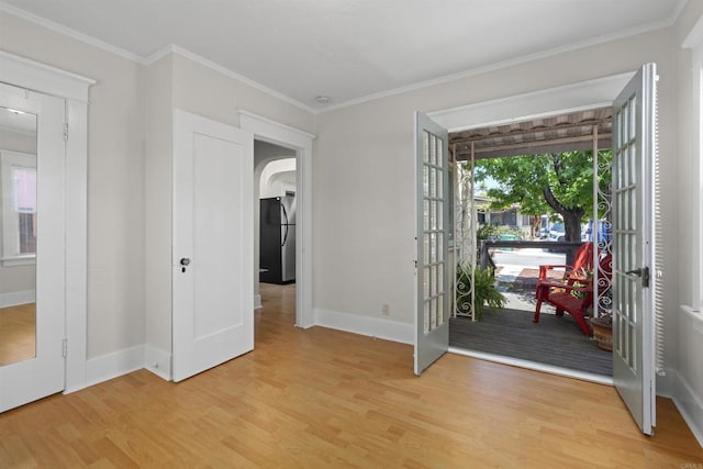 3536 Park Villa, San Diego, CA 92104 - entryway featuring light wood-type flooring, french doors, arched walkways, baseboards, and ornamental molding