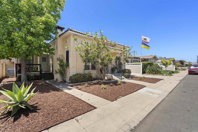 3536 Park Villa, San Diego, CA 92104 - view of front of home with stucco siding, a porch, and a chimney