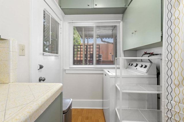 3536 Park Villa, San Diego, CA 92104 - laundry room featuring cabinet space, wood finished floors, baseboards, and washer and clothes dryer