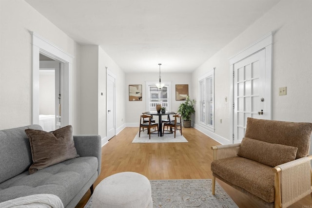 3536 Park Villa, San Diego, CA 92104 - living area with light wood-style flooring, baseboards, and a chandelier