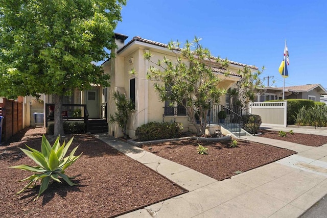 3536 Park Villa, San Diego, CA 92104 - view of front of property with stucco siding, fence, a porch, and a chimney