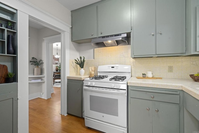 3536 Park Villa, San Diego, CA 92104 - kitchen with white gas stove, under cabinet range hood, gray cabinets, light wood finished floors, and light countertops