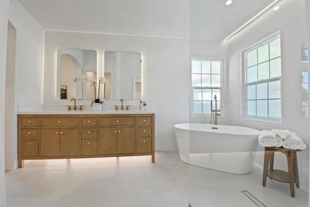 1736 Blackbird Cir, Carlsbad, CA 92011 - bathroom with plenty of natural light, a freestanding bath, and double vanity