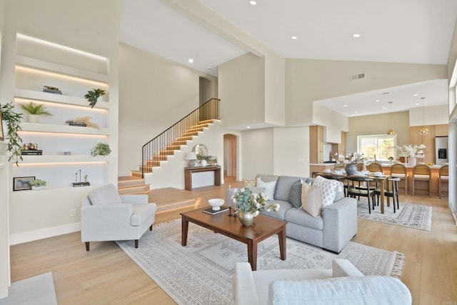 1736 Blackbird Cir, Carlsbad, CA 92011 - living room featuring high vaulted ceiling, light wood finished floors, stairway, and recessed lighting