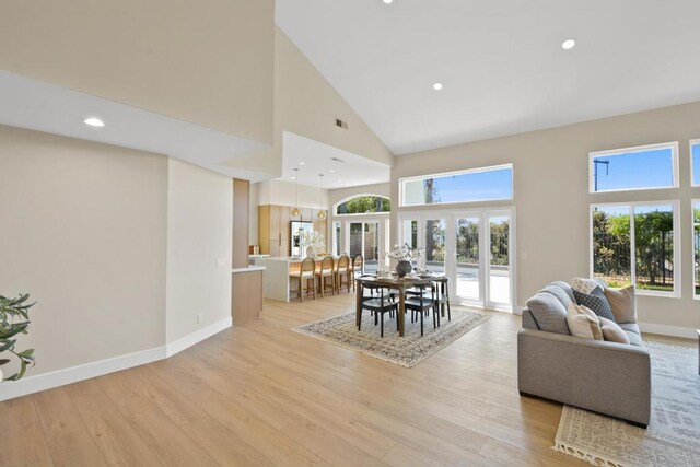 1736 Blackbird Cir, Carlsbad, CA 92011 - dining space featuring a high ceiling, light wood-style flooring, plenty of natural light, baseboards, and recessed lighting