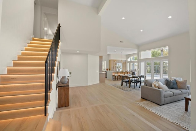 1736 Blackbird Cir, Carlsbad, CA 92011 - living area with high vaulted ceiling, light wood-type flooring, stairway, and recessed lighting