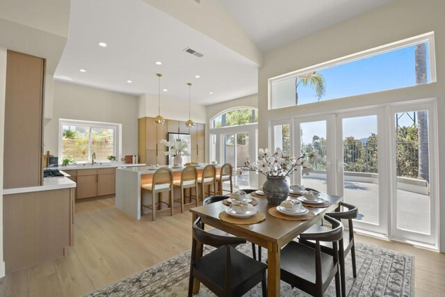 1736 Blackbird Cir, Carlsbad, CA 92011 - dining area featuring a towering ceiling, light wood-style flooring, and recessed lighting