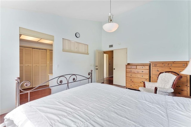 2116 Via Caliente, Fullerton, CA 92833 - bedroom featuring high vaulted ceiling, wood finished floors, and baseboards