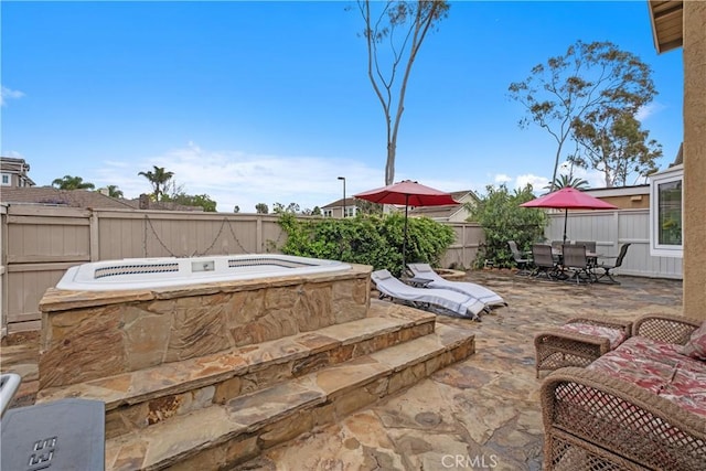 9 Northgrove Unit 11, Irvine, CA 92604 - view of patio / terrace featuring an outdoor hot tub, outdoor dining area, and a fenced backyard