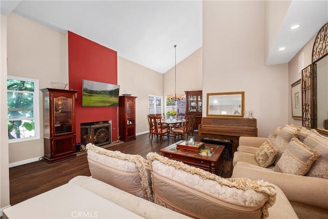 9 Northgrove Unit 11, Irvine, CA 92604 - living room with high vaulted ceiling, dark wood-type flooring, a chandelier, baseboards, and recessed lighting