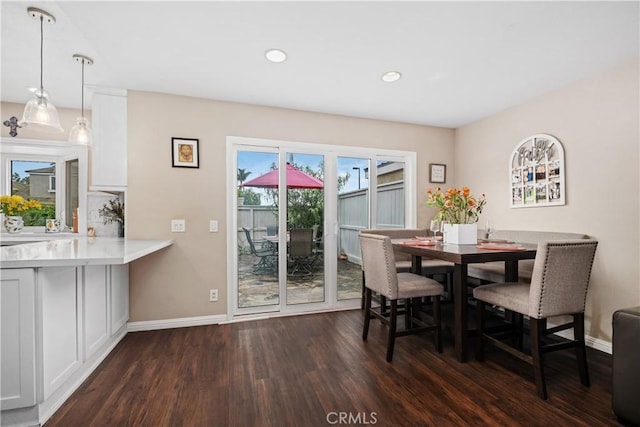 9 Northgrove Unit 11, Irvine, CA 92604 - dining space featuring dark wood-style floors, baseboards, and recessed lighting