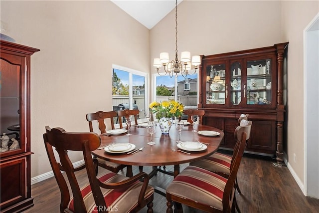 9 Northgrove Unit 11, Irvine, CA 92604 - dining room with a chandelier, dark wood finished floors, baseboards, and high vaulted ceiling