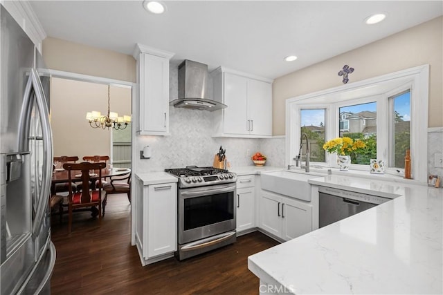 9 Northgrove Unit 11, Irvine, CA 92604 - kitchen featuring stainless steel appliances, wall chimney exhaust hood, a sink, dark wood-style flooring, and backsplash