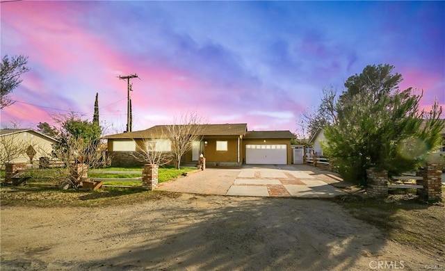 5306 W W Ave M4, Lancaster, CA 93536 - ranch-style home featuring driveway, an attached garage, fence, and stucco siding