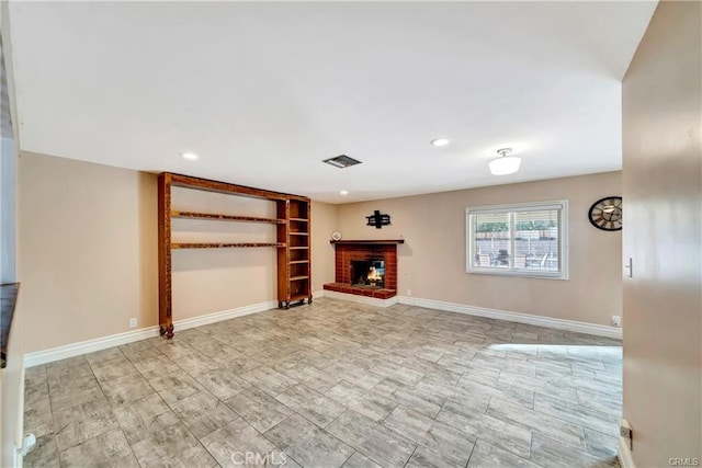 5306 W W Ave M4, Lancaster, CA 93536 - unfurnished living room featuring a brick fireplace, recessed lighting, and baseboards