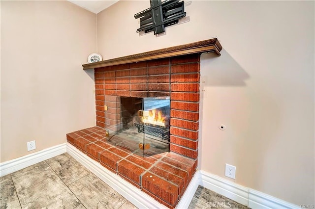 5306 W W Ave M4, Lancaster, CA 93536 - detailed view of baseboards and a fireplace