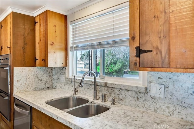 5306 W W Ave M4, Lancaster, CA 93536 - kitchen with a sink, brown cabinets, backsplash, stainless steel appliances, and light stone countertops