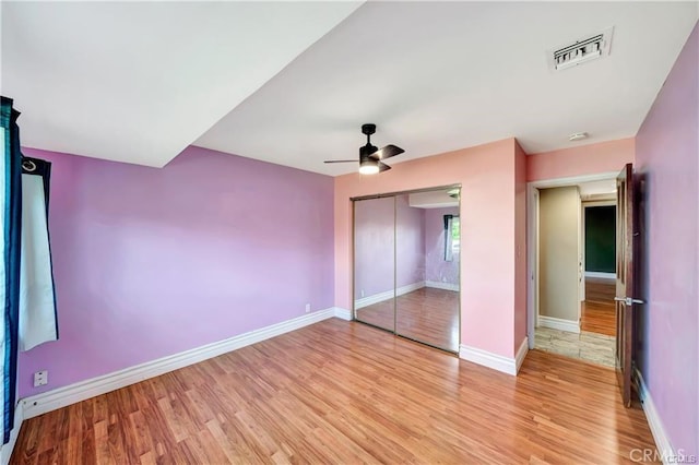 5306 W W Ave M4, Lancaster, CA 93536 - unfurnished bedroom featuring light wood-style floors, a closet, and a ceiling fan