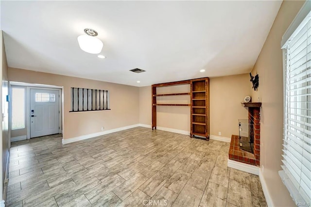 5306 W W Ave M4, Lancaster, CA 93536 - unfurnished living room featuring a fireplace, recessed lighting, and light wood-type flooring