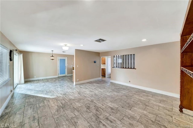 5306 W W Ave M4, Lancaster, CA 93536 - unfurnished living room featuring recessed lighting and wood tiled floors