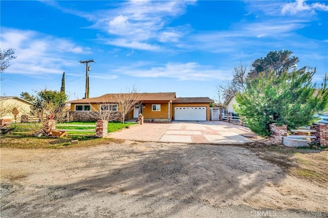 5306 W W Ave M4, Lancaster, CA 93536 - view of front of home featuring a garage, driveway, and fence