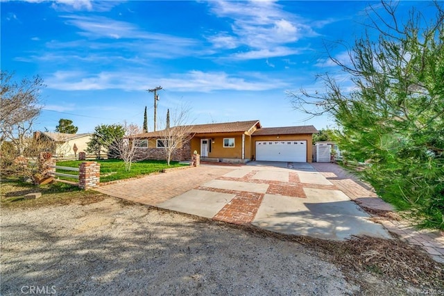 5306 W W Ave M4, Lancaster, CA 93536 - ranch-style house featuring driveway, an attached garage, fence, and stucco siding